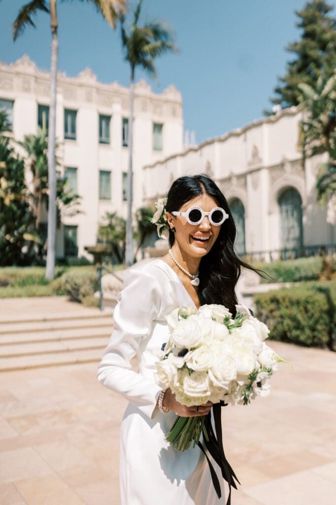 Couple celebrating after their courthouse wedding at the Beverly Hills Courthouse, capturing candid, joyful moments in a classic Los Angeles setting, How to Get Married at the Beverly Hills Courthouse (Cost, Timeline + Photo Tips) , how to get married at the Beverly Hills Courthouse, Beverly Hills Courthouse wedding, Beverly Hills Courthouse elopement, Elopement at the Beverly Hills Courthouse, Beverly Hills Courthouse Wedding, how to have a wedding at the Beverly Hills Courthouse