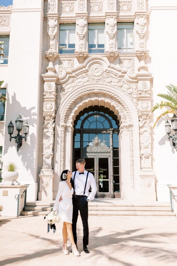 Couple celebrating after their courthouse wedding at the Beverly Hills Courthouse, capturing candid, joyful moments in a classic Los Angeles setting, How to Get Married at the Beverly Hills Courthouse (Cost, Timeline + Photo Tips) , how to get married at the Beverly Hills Courthouse, Beverly Hills Courthouse wedding, Beverly Hills Courthouse elopement, Elopement at the Beverly Hills Courthouse, Beverly Hills Courthouse Wedding, how to have a wedding at the Beverly Hills Courthouse
